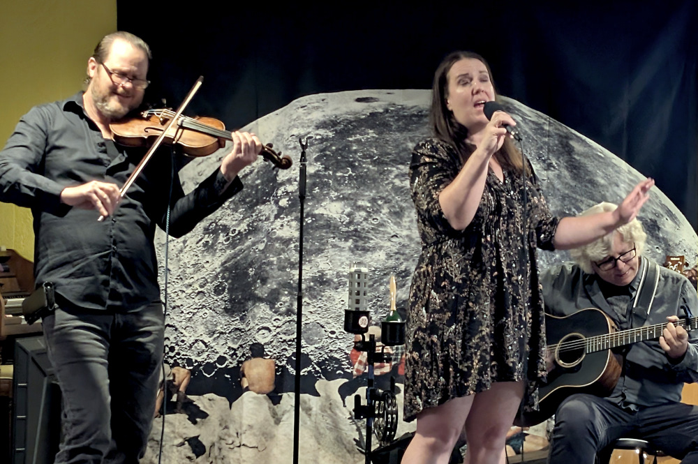 Kate Hinote Trio performing under the bridge